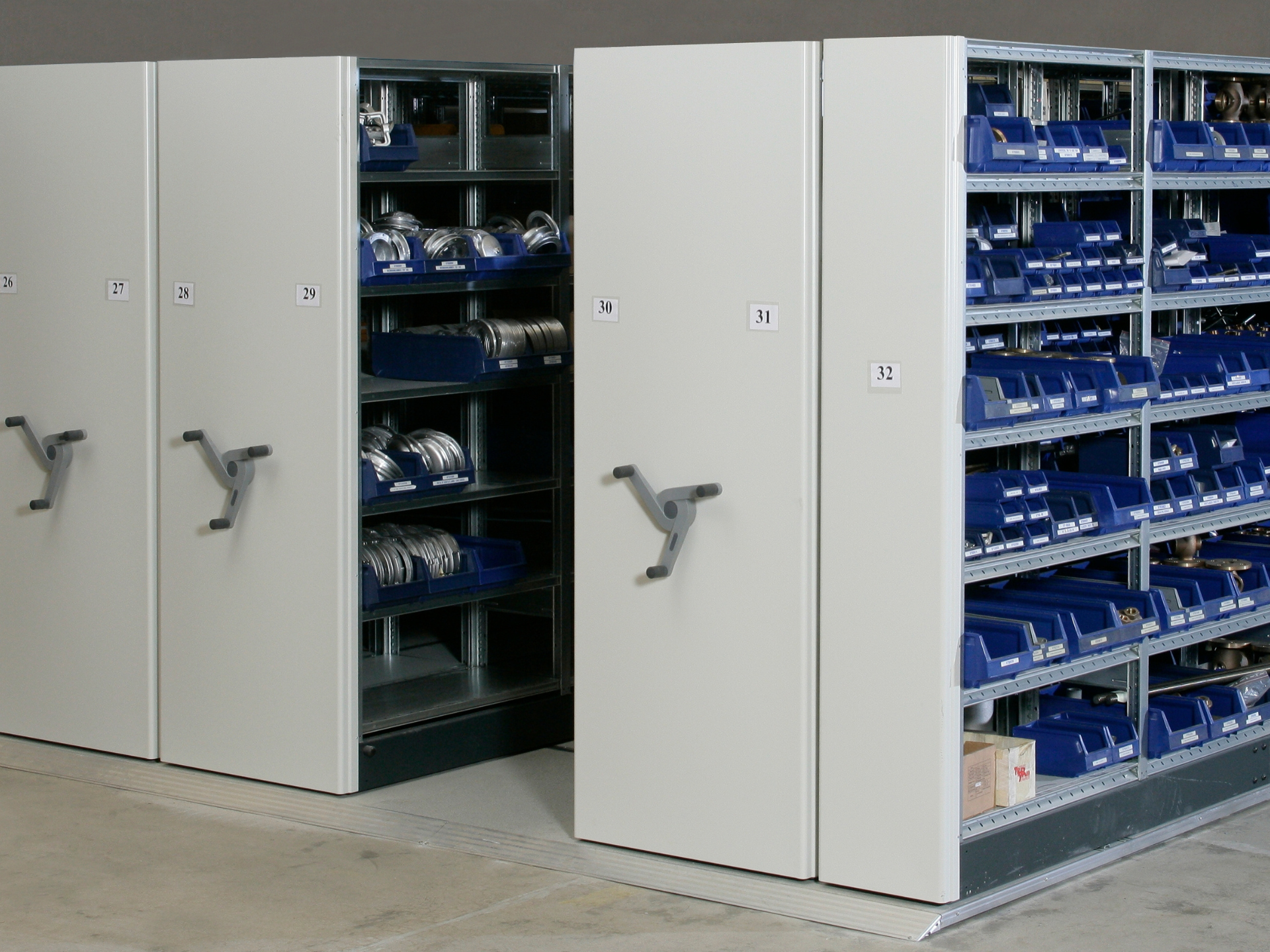 mobile warehouse shelving in compact storage area