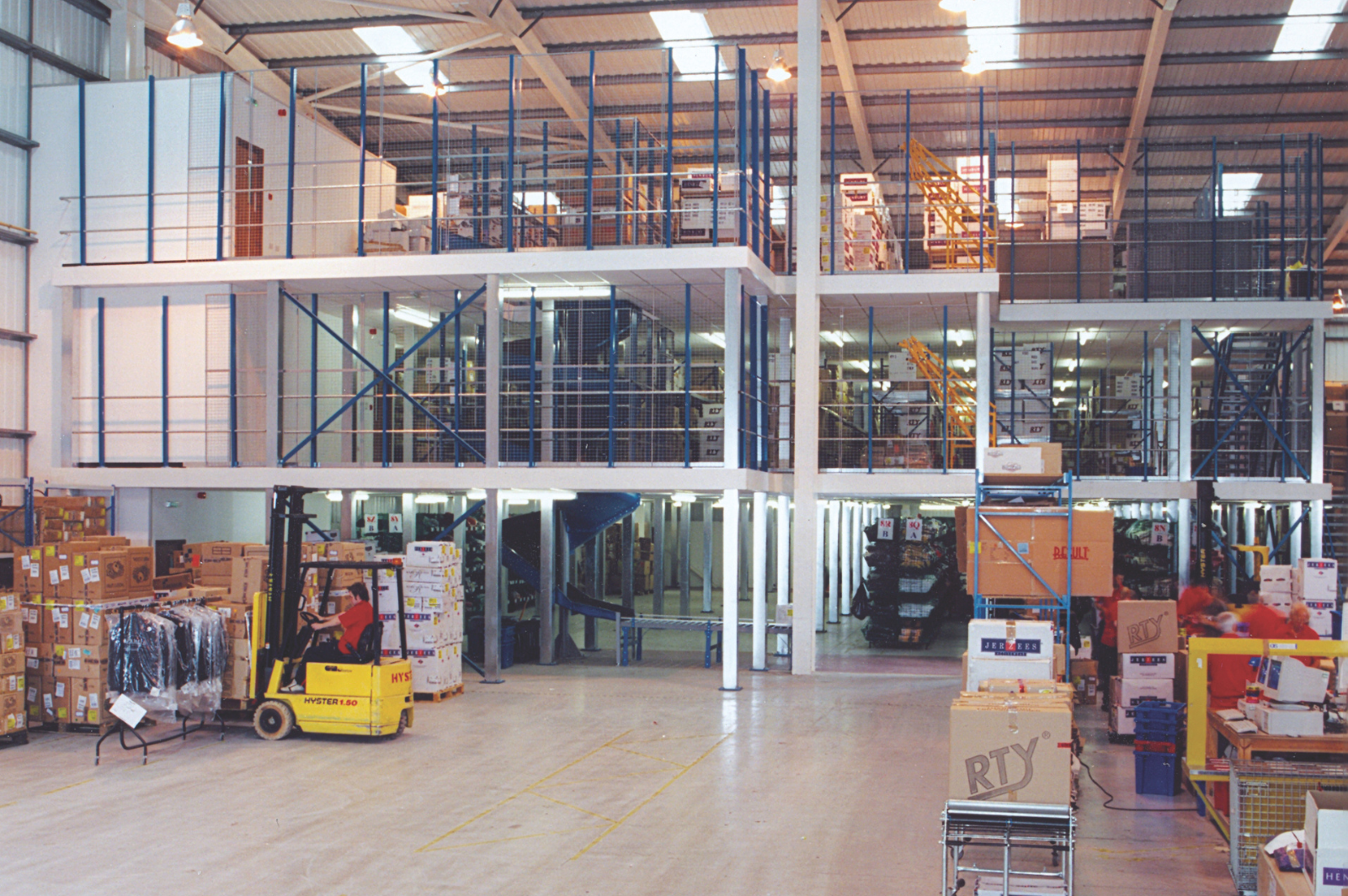 Logistics mezzanine floor over packing area